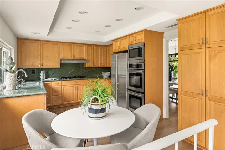 The kitchen fatures an eat-in nook.