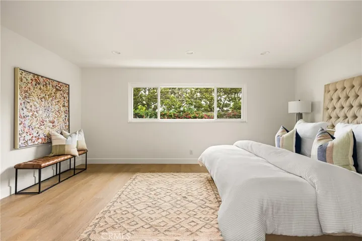 The oversized Main bedroom overlooks lush greenery, providing privacy and lovely light.