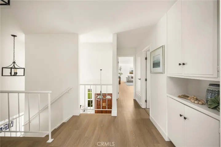 The light from below floods the upper landing. The view is to the huge bonus room.