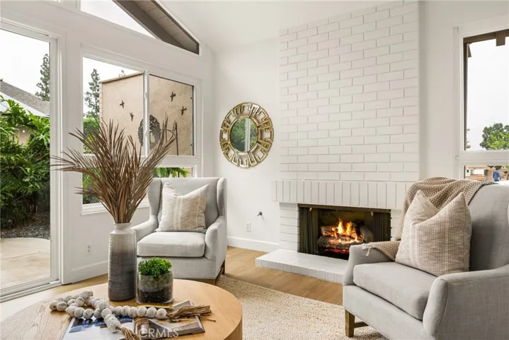Formal living room features a full wall fireplace.
