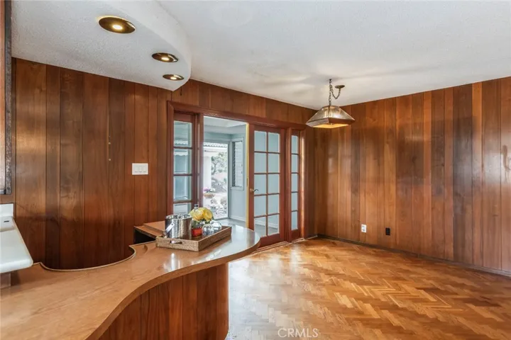French doors to an additional room with flex space for an office, gym or craft/hobby room