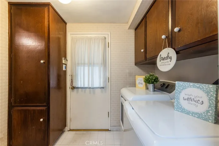 Separate laundry room inside, across from the powder room and door leading out to the backyard, garage and side gate