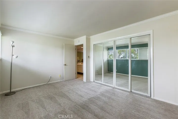Third bedroom with fresh paint and wardrobe mirror doors
