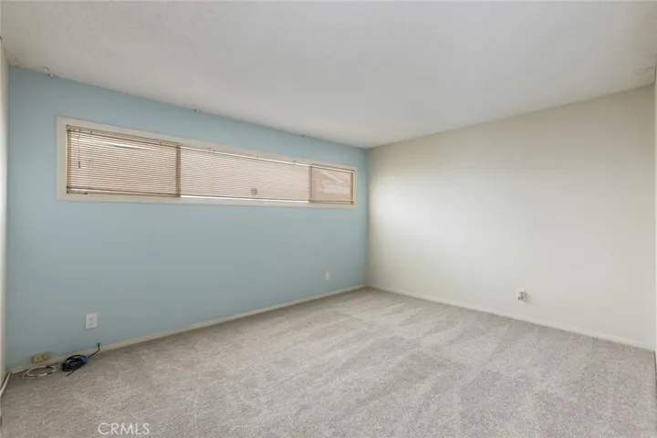 Freshly painted second (middle) bedroom with accent wall