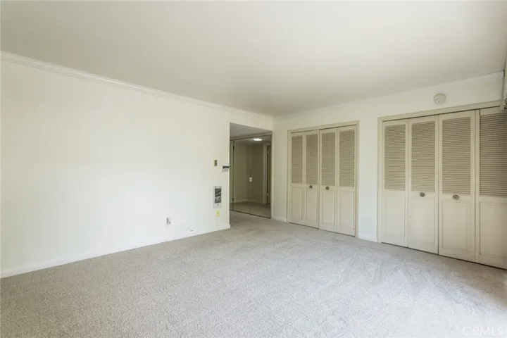 His and her closets in the primary bedroom
