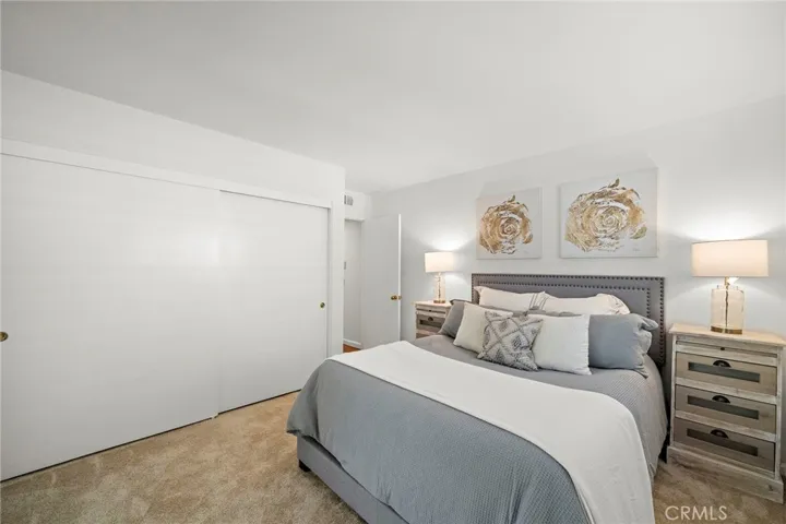 Downstairs, a large bedroom with dual-door access and a remodeled bathroom offers excellent guest or in-law accommodations.