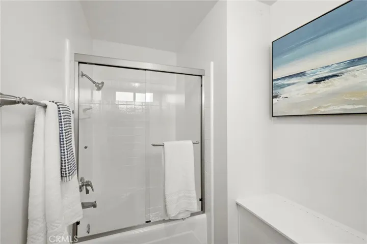 A newly glazed tub/shower combo with new glass doors