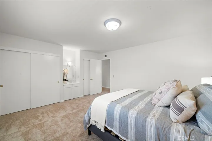Bedroom 4 with dual closets and sit down vanity area.