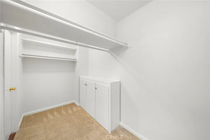 Huge walk in closet with dual door his/her access.