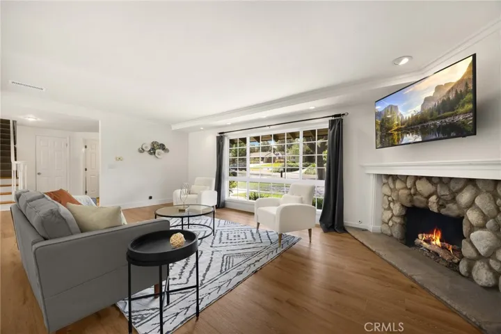 gas fireplace mantle and views of neighborhood, spacious lawn and​​‌​​​​‌​​‌‌​​‌​​​‌‌​​​‌​​‌‌​​‌‌​​‌‌​​​​ trees