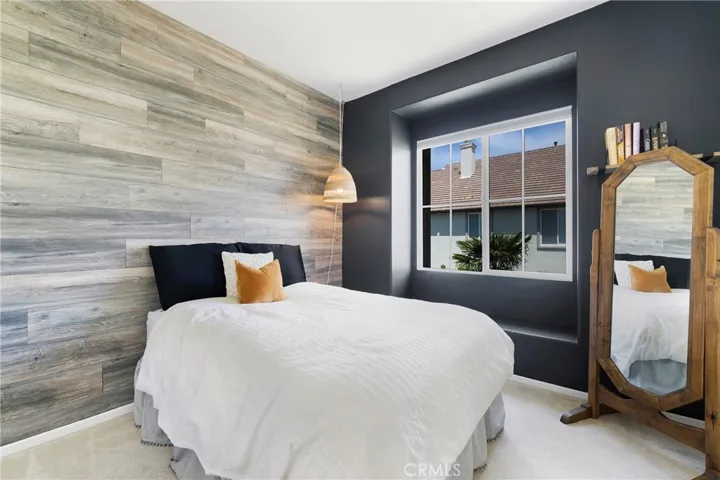 This secondary bedroom boasts and window seat.