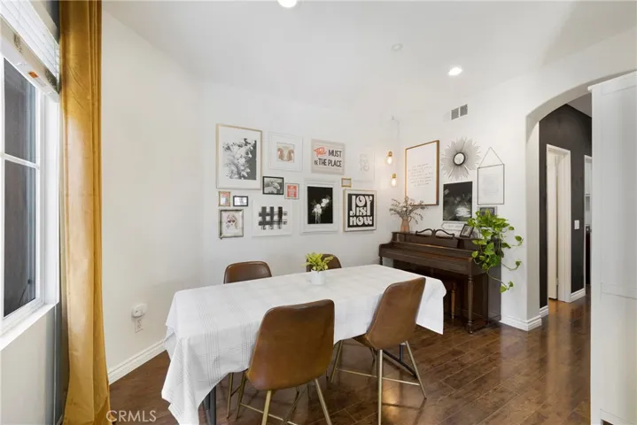 Dining room opens to the kitchen as well as the living room.