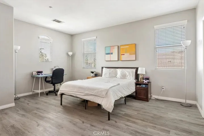Generously sized and full of potential, this bedroom can serve as a second primary suite, teen retreat, or flexible shared space. With multiple windows providing abundant sunlight, it’s ideal for studying, relaxing, or working from home. Ample room for a desk setup, reading corner, or additional furnishings makes this space as versatile as it is comfortable.