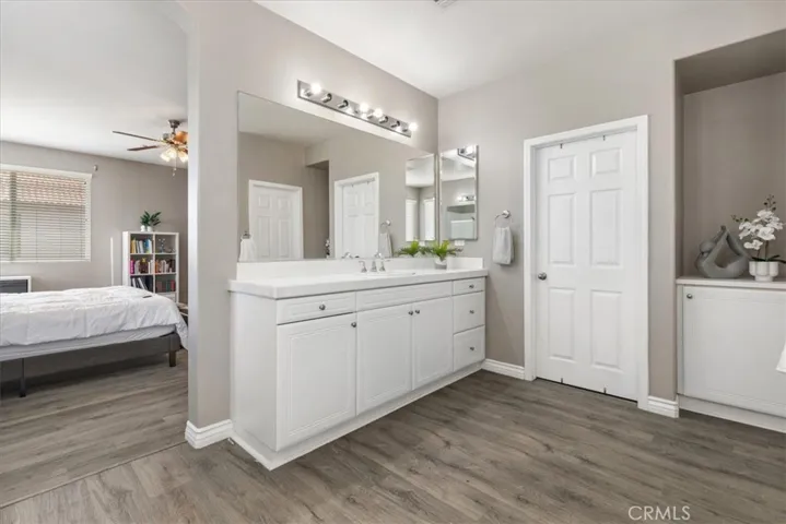 Expansive walk-in closet in the Primary bathroom offering plenty of space to organize and showcase your wardrobe with ease and style.