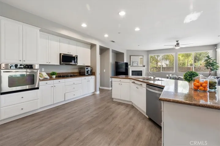 Cook, gather, and entertain in this bright and airy kitchen that flows seamlessly into the great room.