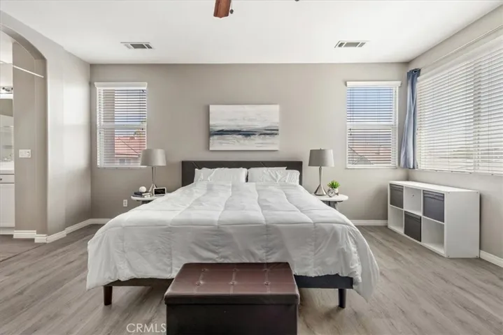 Welcome to your spacious primary bedroom — a warm, inviting retreat designed for restful nights and peaceful mornings, where comfort meets elegance.
