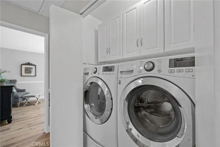 Inside laundry with storage.