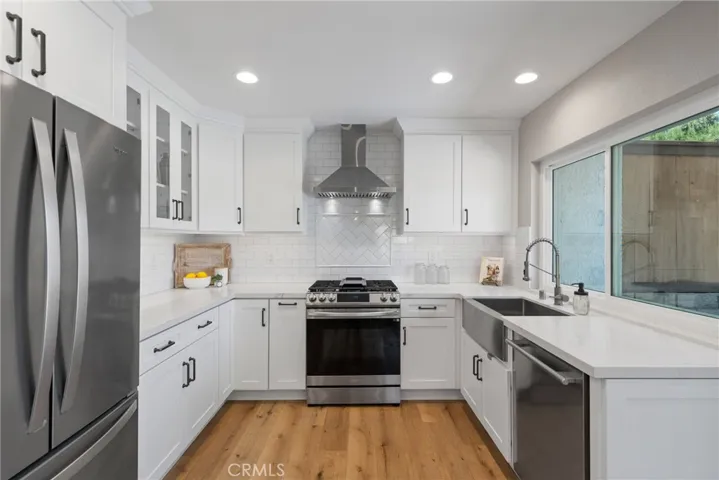 White Shaker cabinets and quartz countertops.
