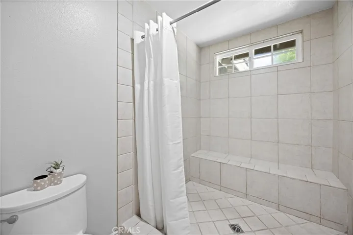 Large primary shower with seat wall