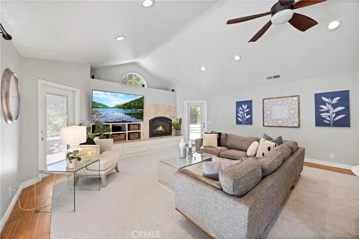 Great Room with built-in fireplace with raised hearth