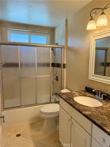Secondary bathroom upstairs with tub and shower.