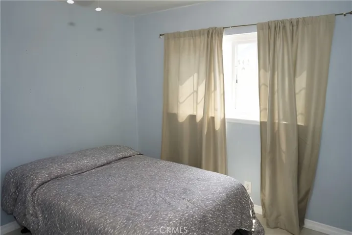 Bedroom #2 with ceiling fan.