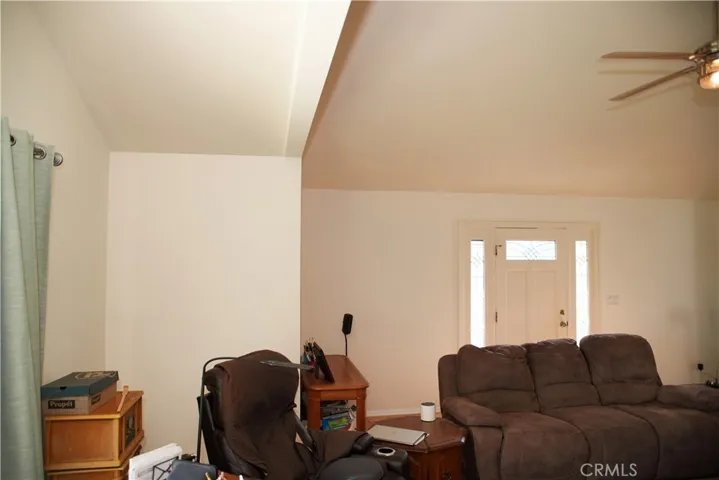 Front door has two side windows and one over door making a bright room.