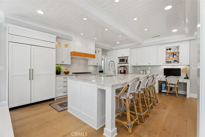 The custom wood craftsmanship, solid marble countertops and oversized center island with top of the line appliances!!