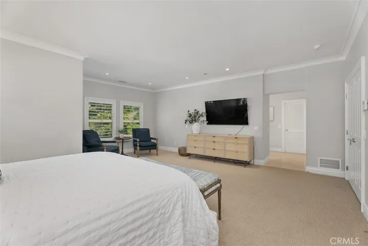 Primary bedroom looking towards en-suite private full bathroom