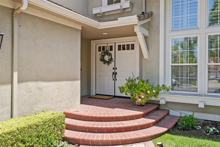 A charming brick front porch sets the tone for this elegant entry. Stately double doors welcome you into a home filled with warmth, style and comfort.