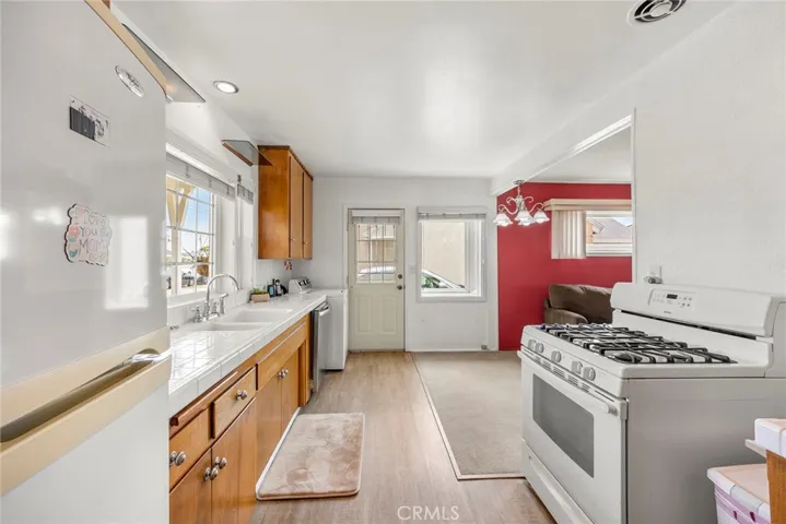 Kitchen with view of side door, direct access to driveway
