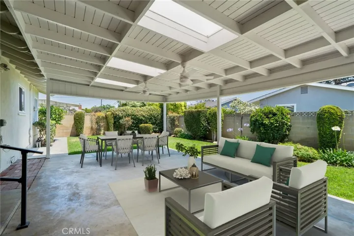 Enjoy al fresco dining under the large covered patio and play on the expansive grassy area
