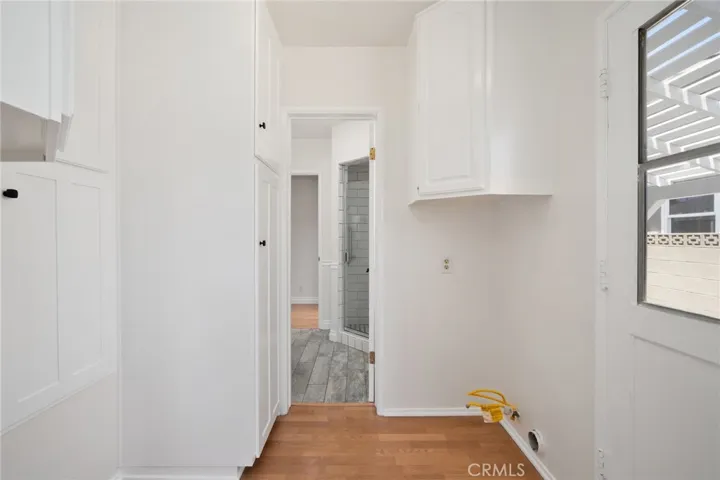 A convenient interior laundry room is located just off the kitchen for added practicality.