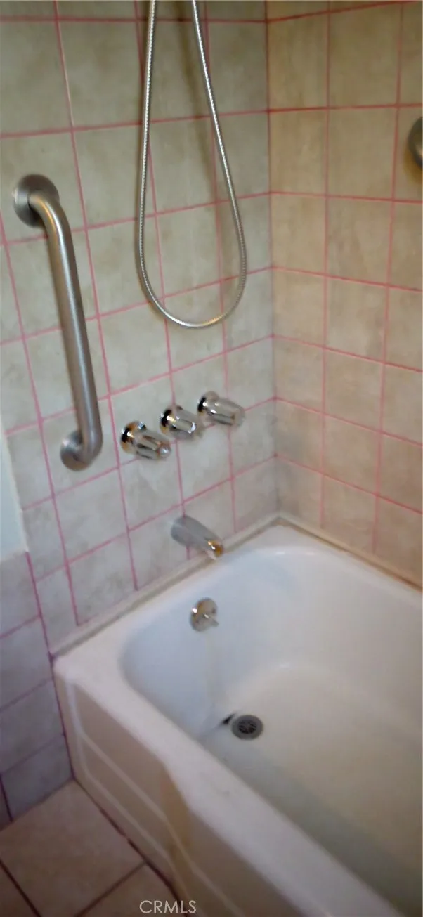 View of shower bathtub combo.