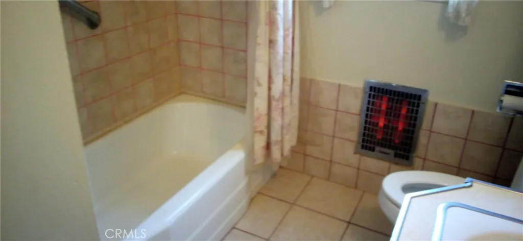 View of bathtub enclosure.