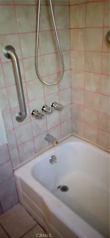 View of shower bathtub combo.
