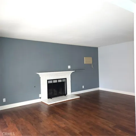 Living Room with Gas Fireplace and Wall Evaporative Cooler