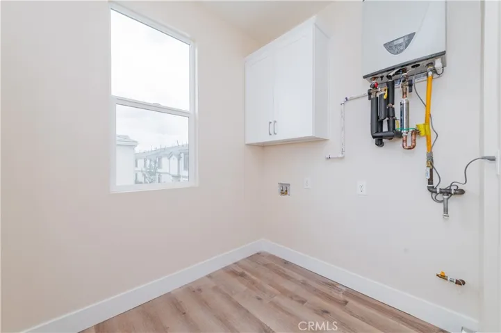 Laundry Room with Tankless water heater
