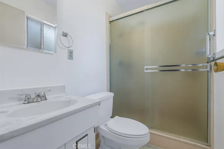 Ensuite bath in Primary Suite features a full-size walk-in shower
