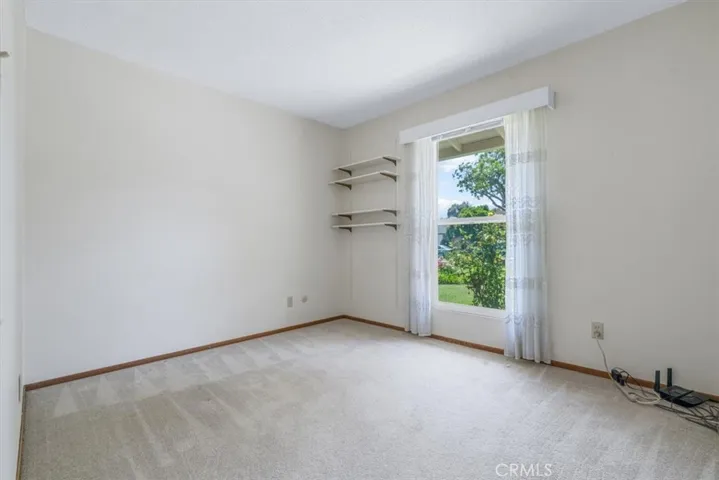 Bedroom 3 overlooks front yard flower garden and is closest to the front entry and across from hall bathroom. The data hub is located in this room.