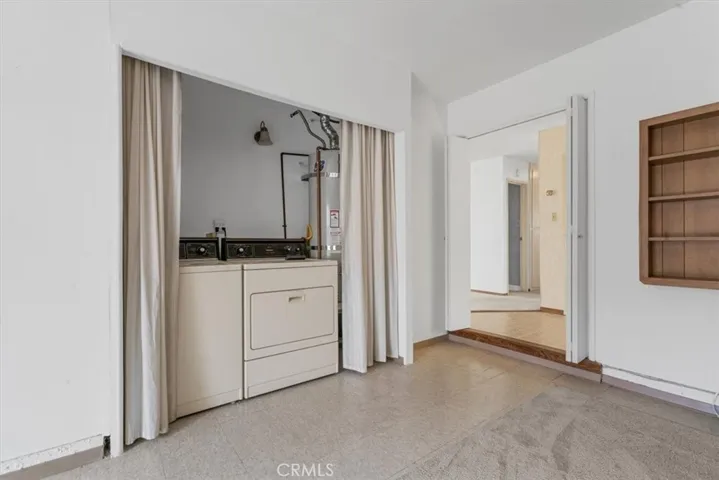 Laundry area is centrally located in Family Room.