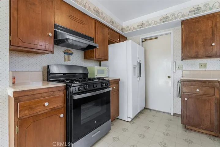 The kitchen has a newer gas stove.