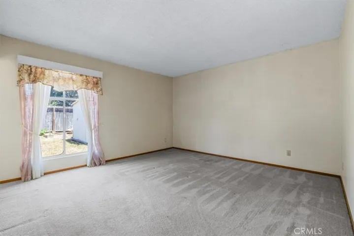 The large window in Primary Suite could become slider or French Door direct access to back yard.
