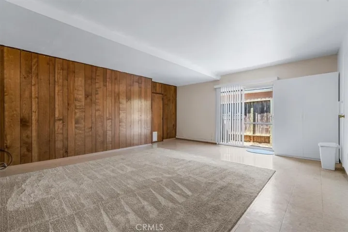 The Family Room, with slider to side yard, is conveniently accessed from the Entry Hall and Kitchen