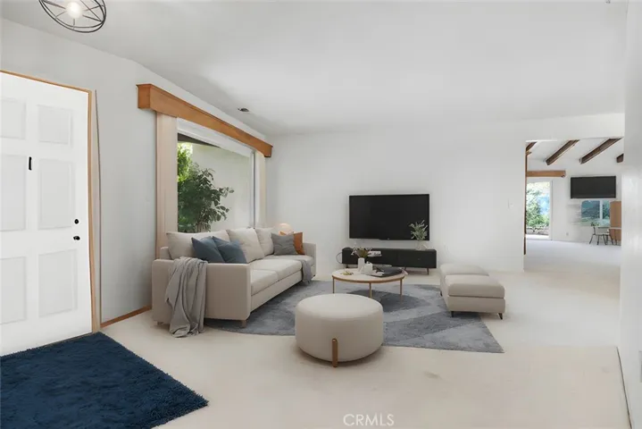 Virtually staged formal living room.
