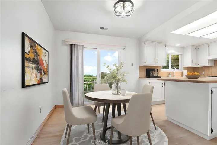 Virtually staged breakfast nook.