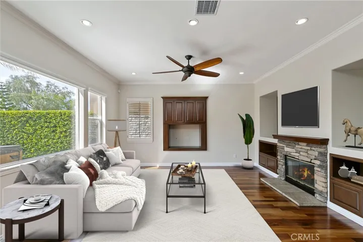 Family room with dual side fireplace and large picture window
