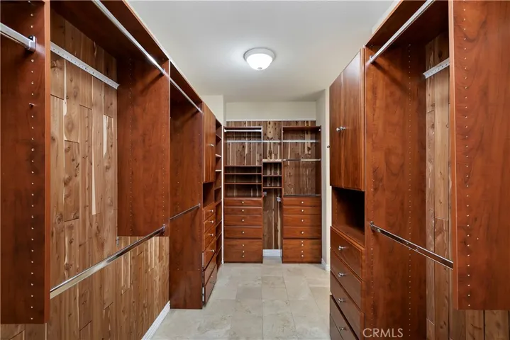 Spacious primary bedroom walk in closet