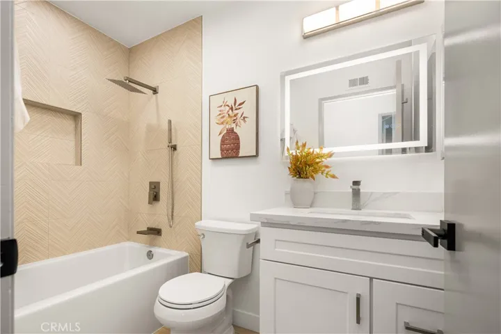 chevron tiled tub/shower, LED fogless mirror,