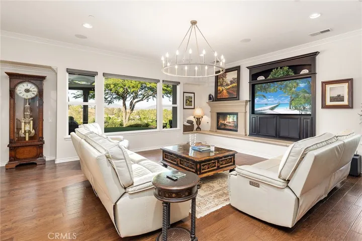 Family Room with built in Entertainment Center and Raised Hearth Fireplace